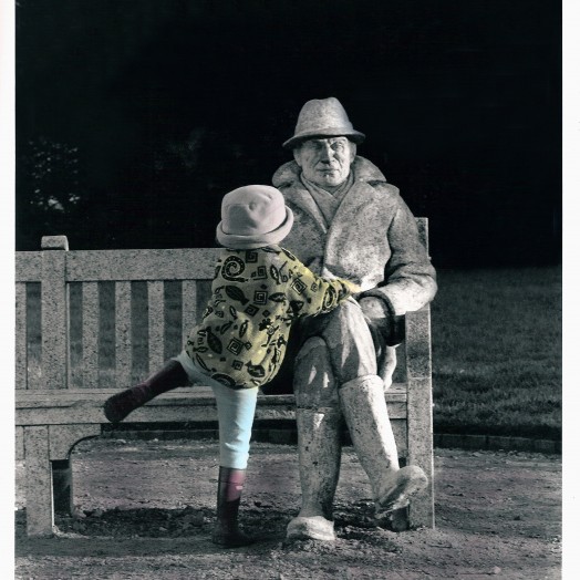 Small child climbing on sculpture